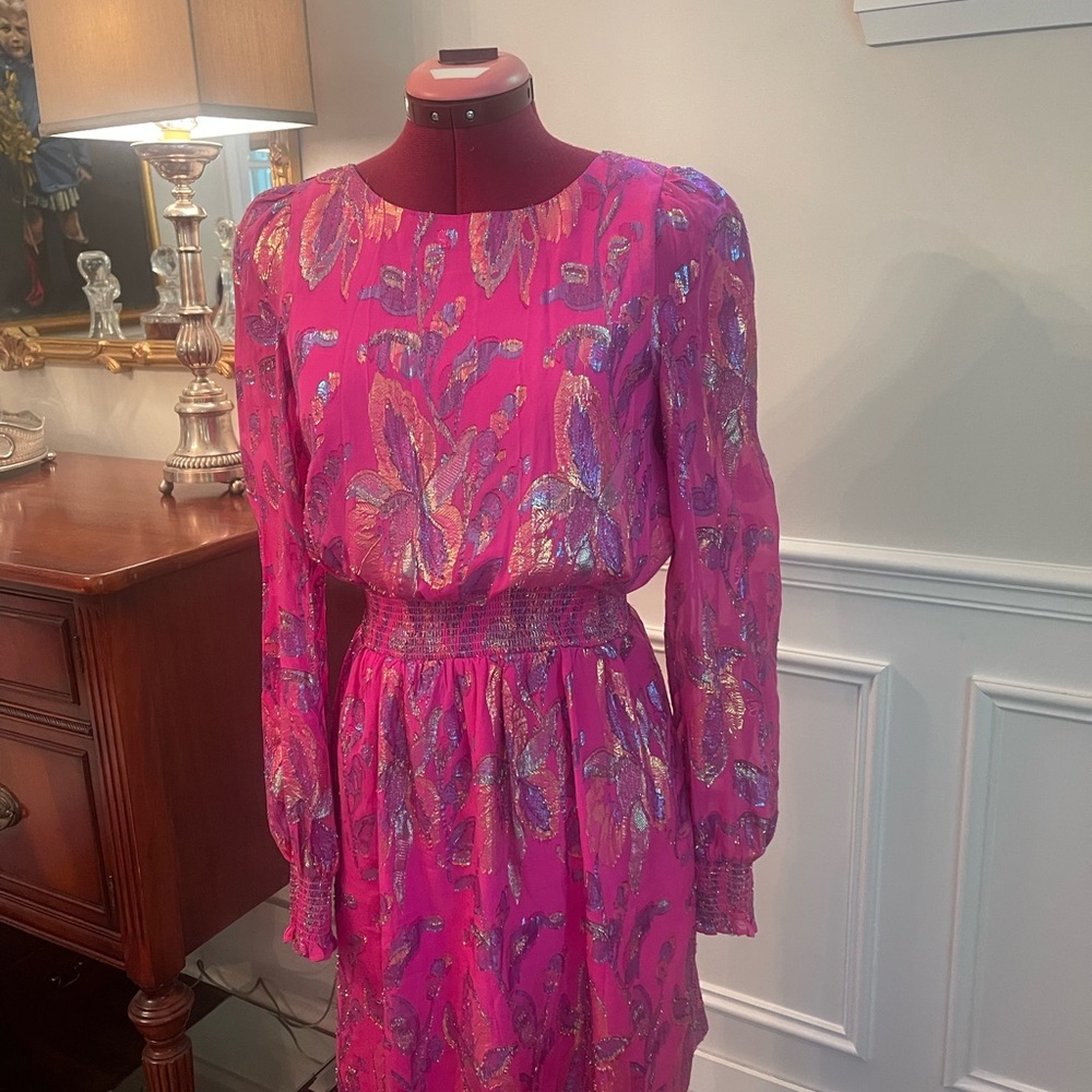 Lilly Pulitzer pink dress with a floral pattern, cinches the waste beautifully